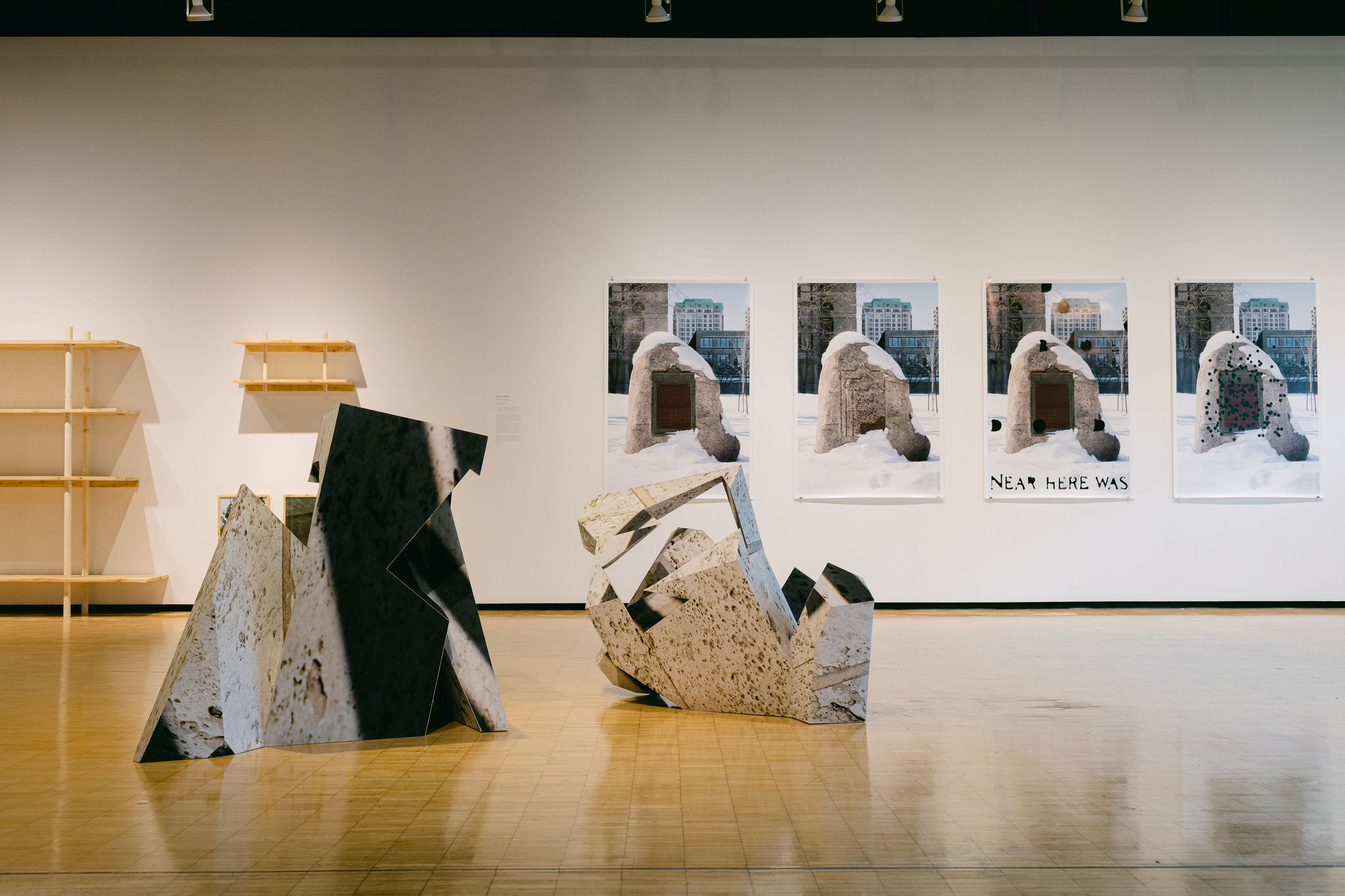 Abstract sculptures and snowy monument photos in a gallery
