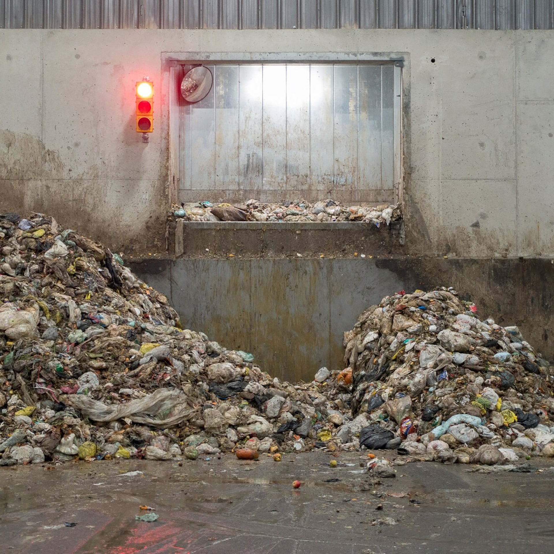 Trash heaped at a waste management facility