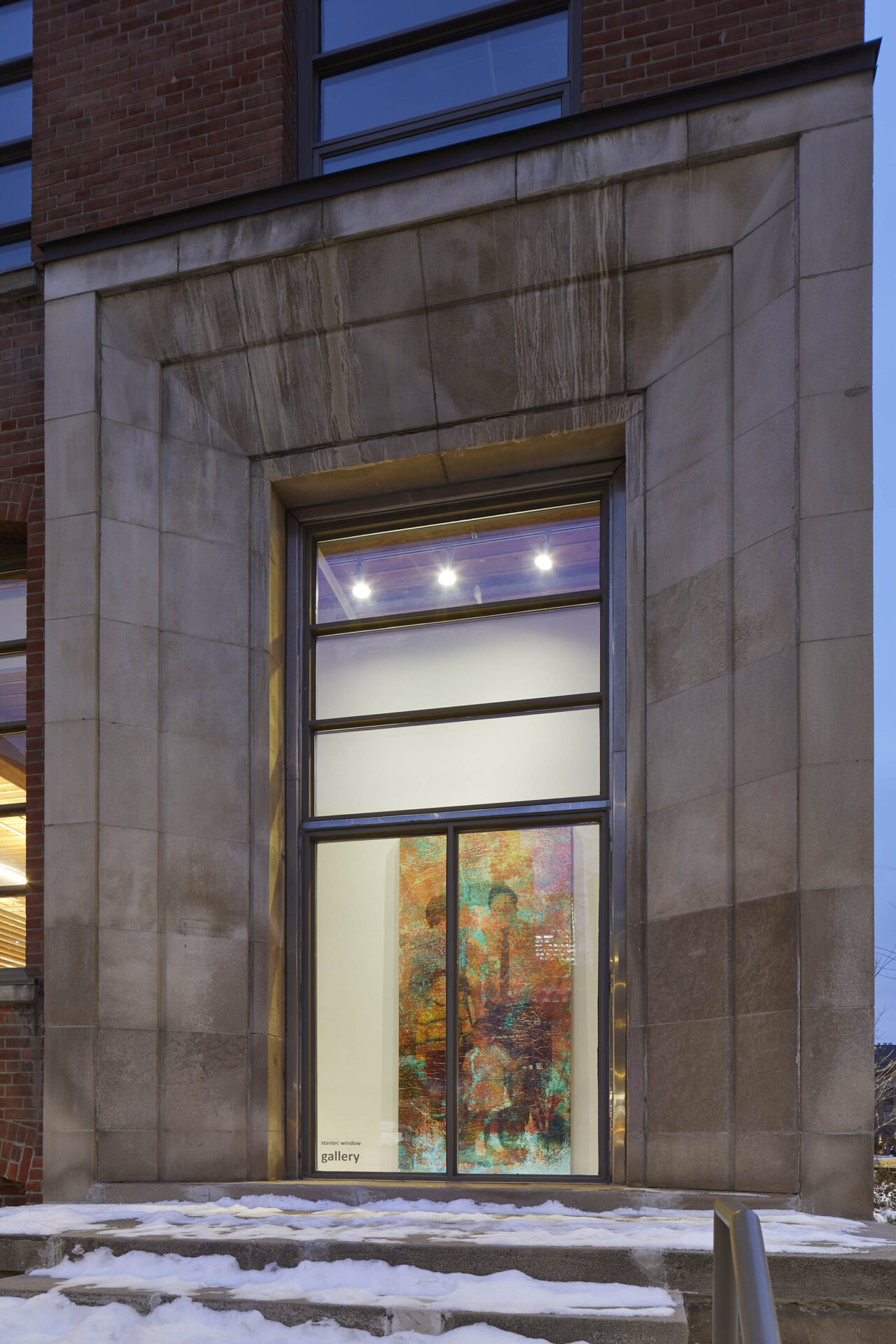 Street view of window gallery featuring an enlarged family photograph printed onto a corroded copper plate.