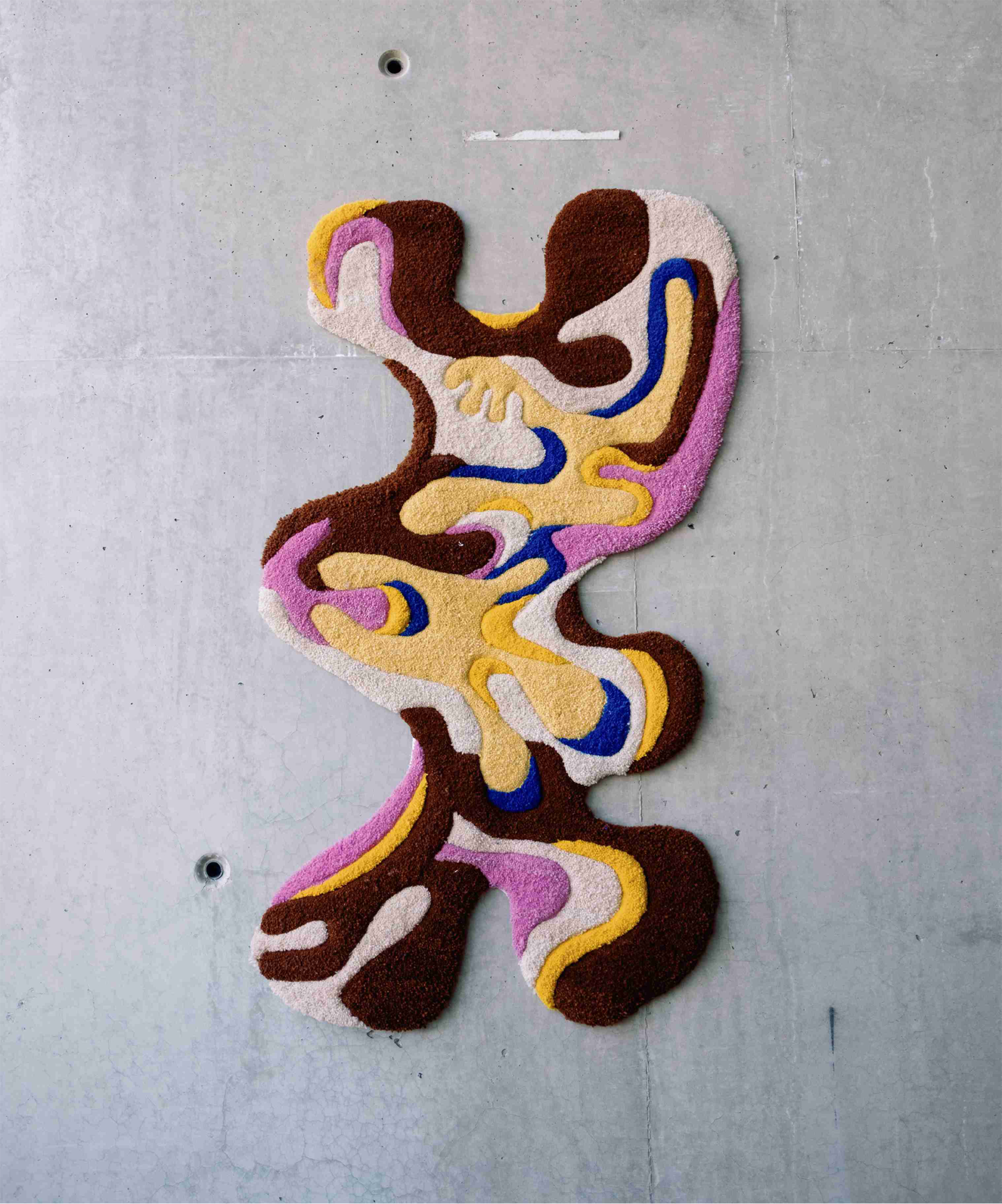 Organic shaped multi-coloured tufted rug