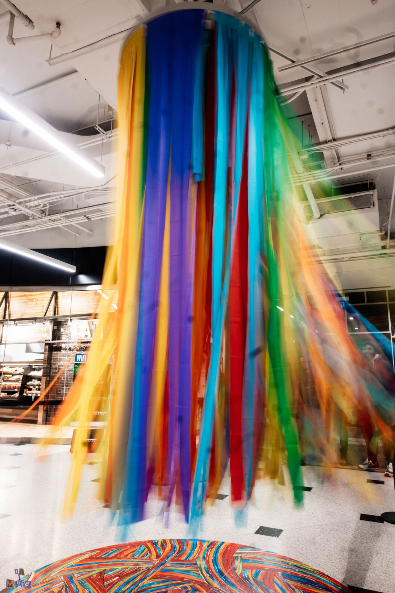 multicoloured ribbons coming from ceiling