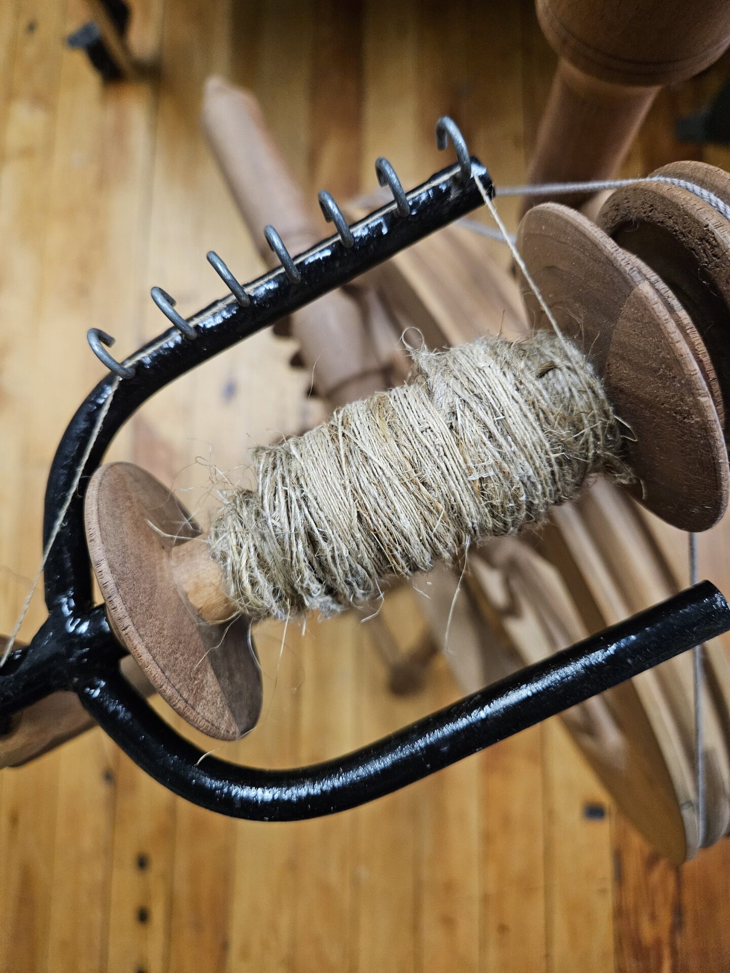 Spindle containing handspun flax thread