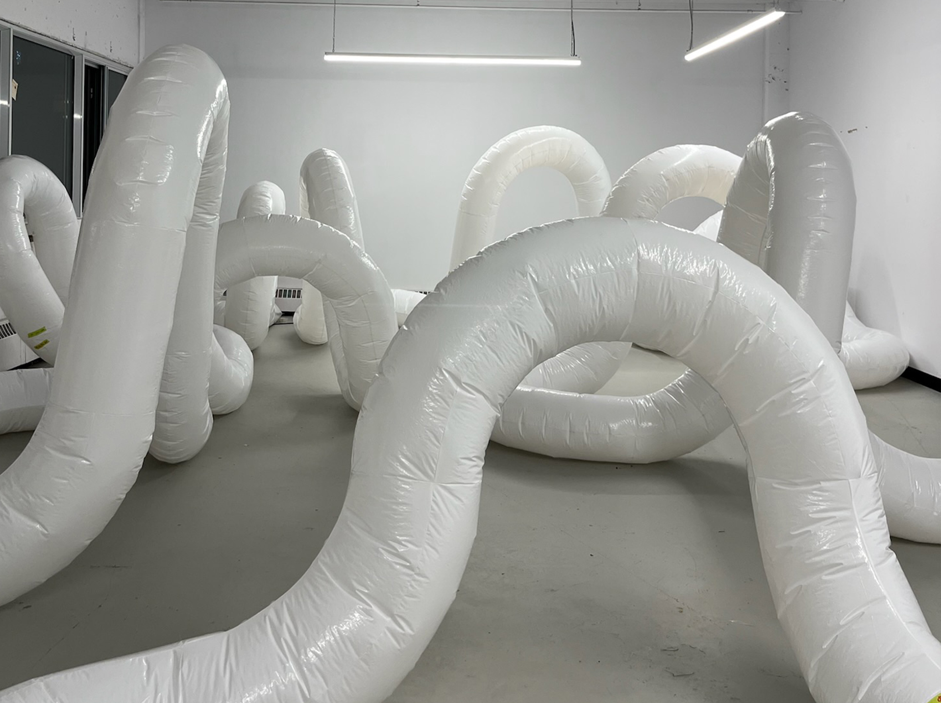 Image of inflatable tubes in a white industrial interior