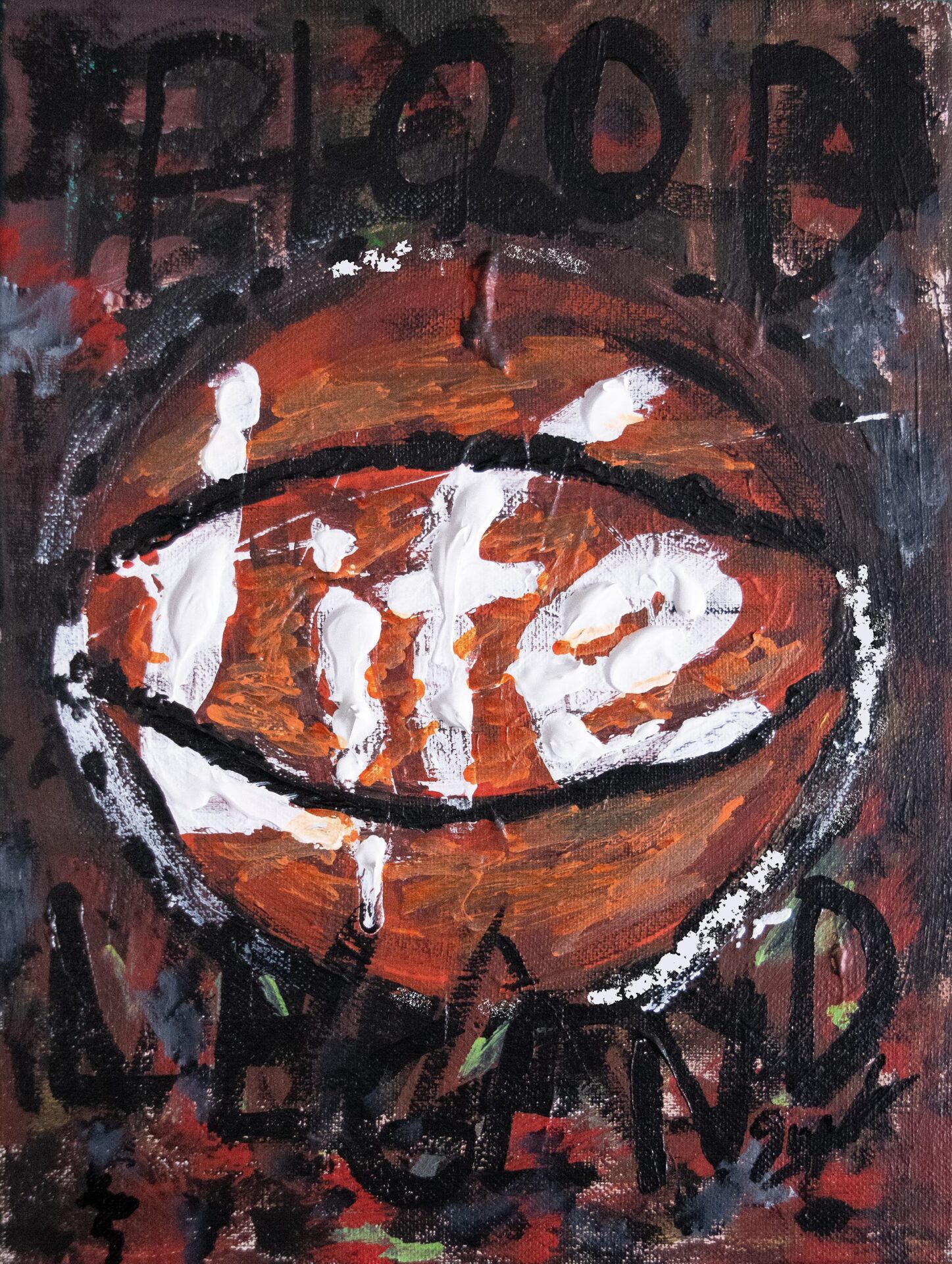 A painting with an orange basketball with its lines caging the word “Life.” The multicoloured dark background obscures the words “Hood Legend.”