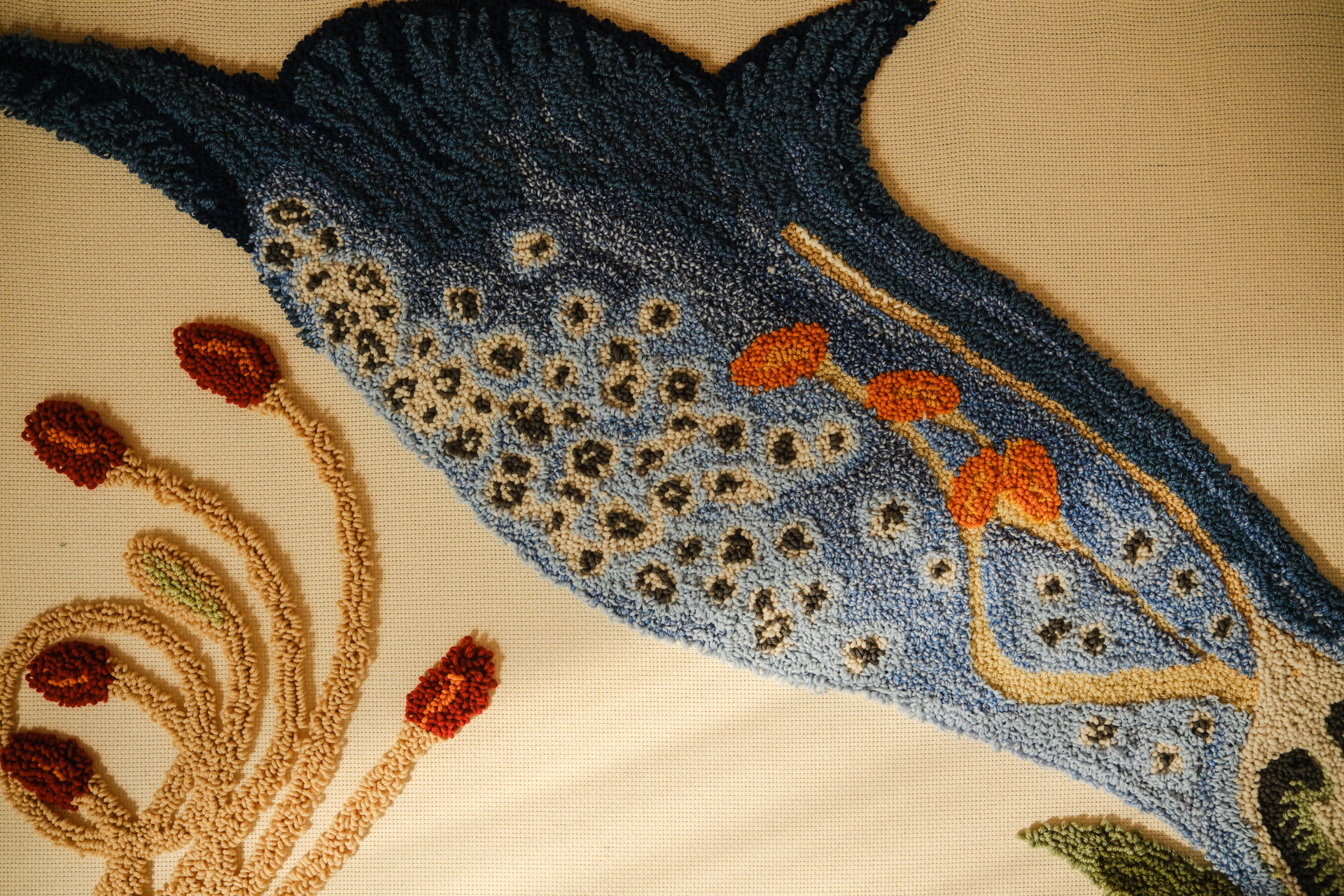 Punch needle of a blue foxglove flower. 