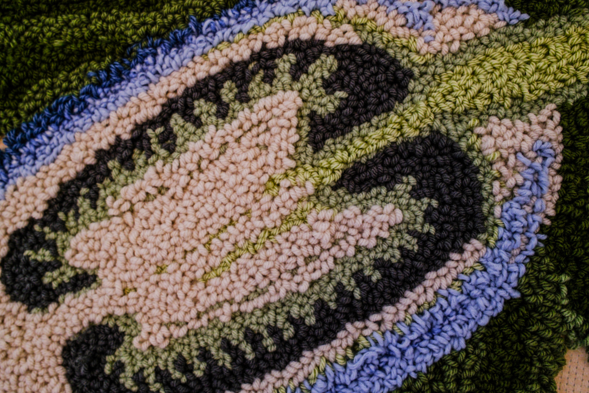Close-up shot of a punch needle of a blue foxglove flower. 