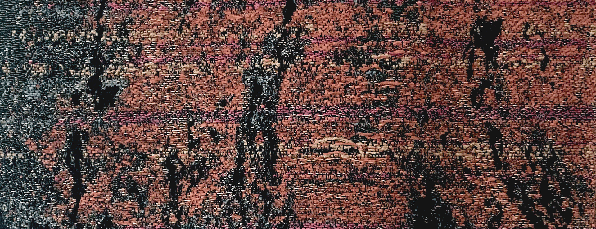 Detail of a weaving in warm coloured yarns