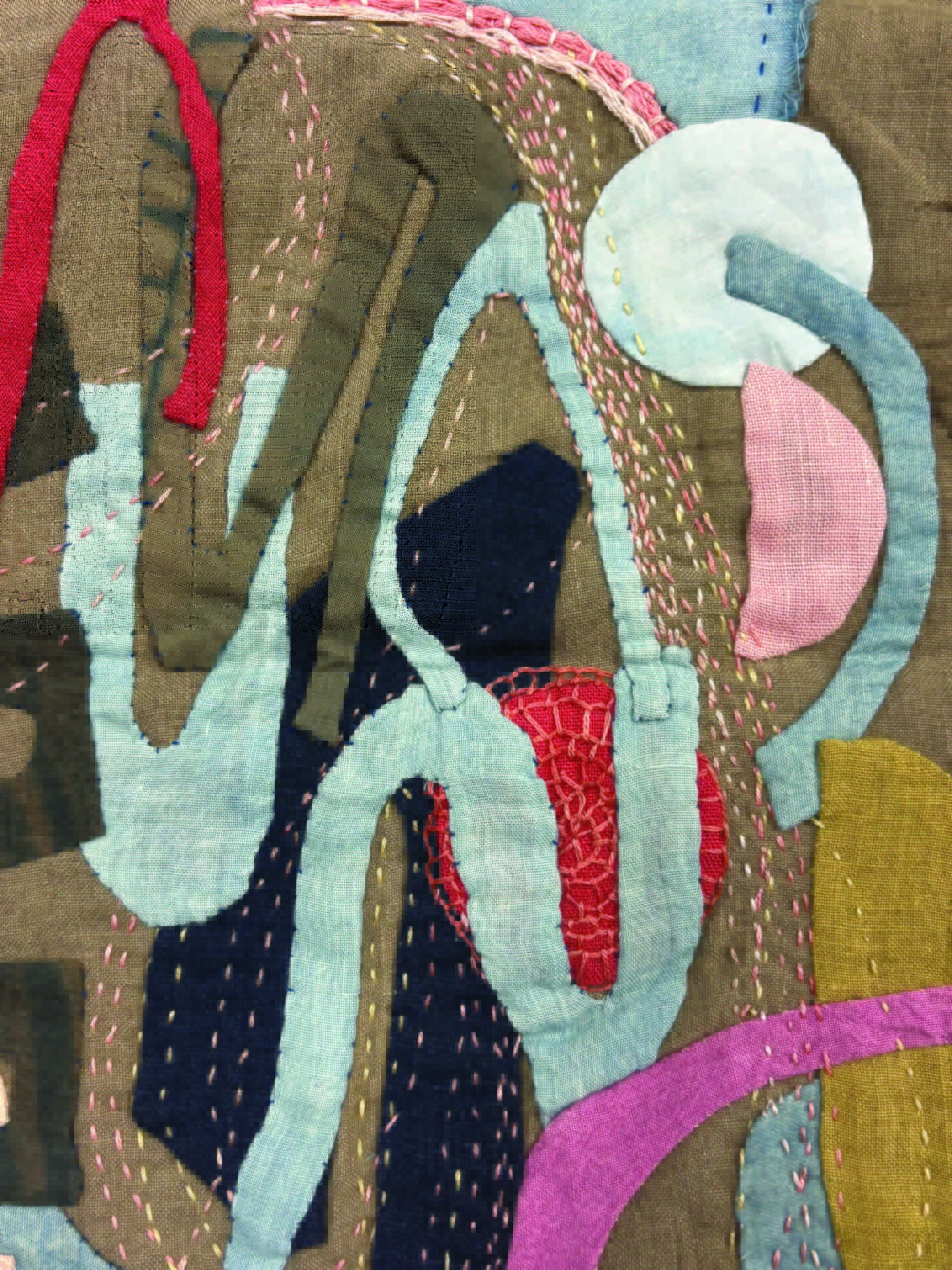 multi coloured textile collage with applique and stitching