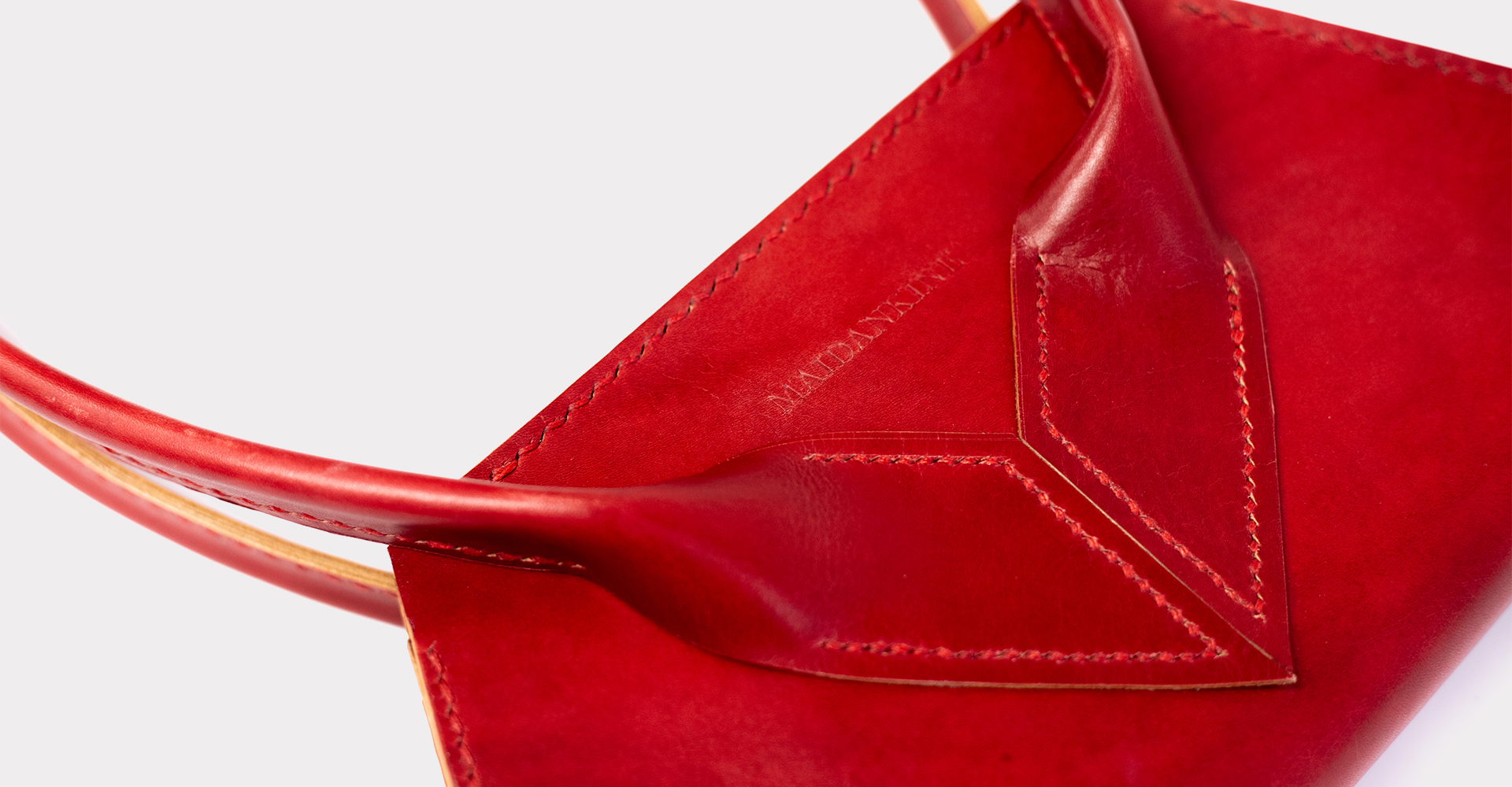 Moulded piece of black leather on white background