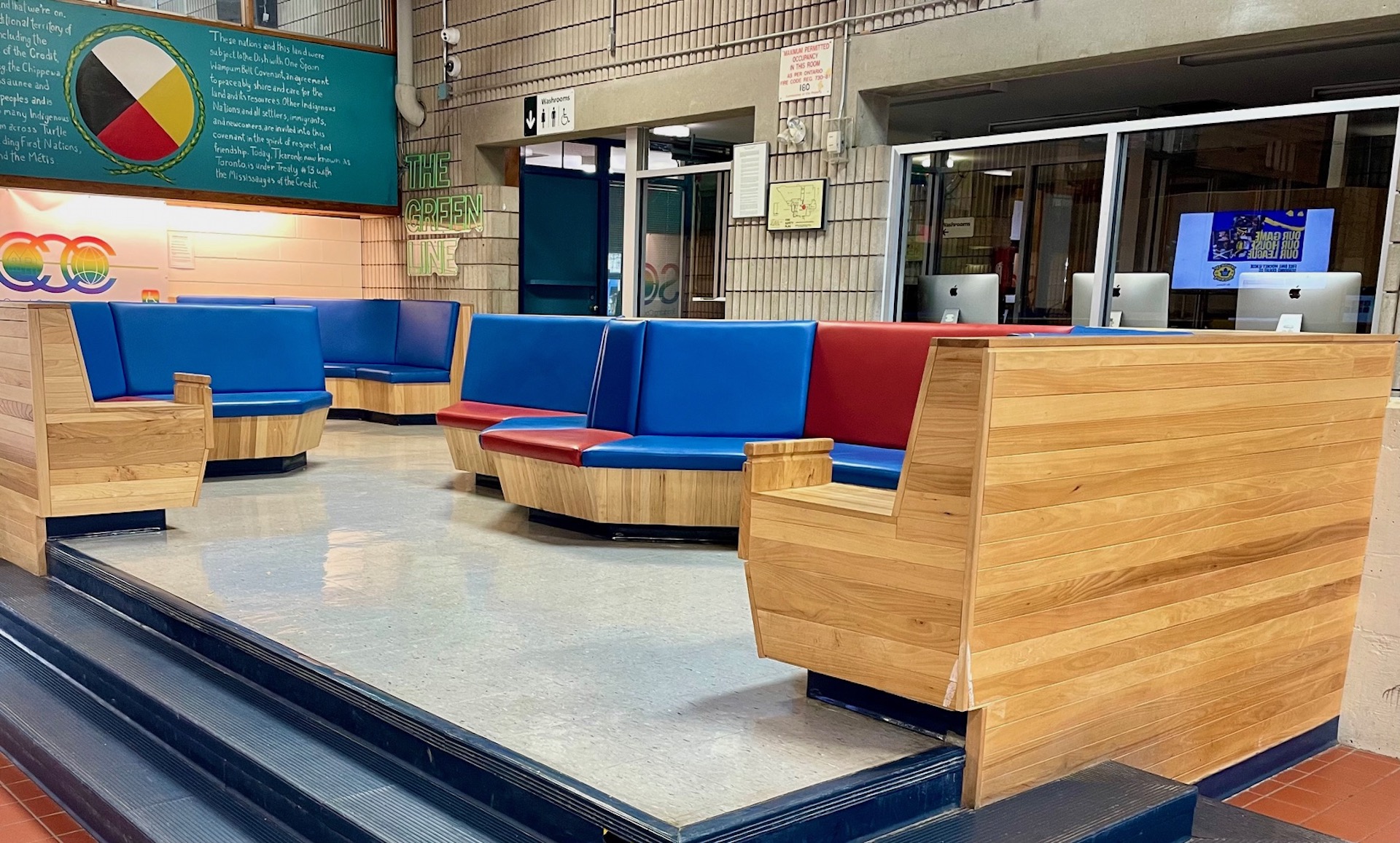 Lobby Seating, red and blue upholstered seating arranged in a faceted, undulating arrangement