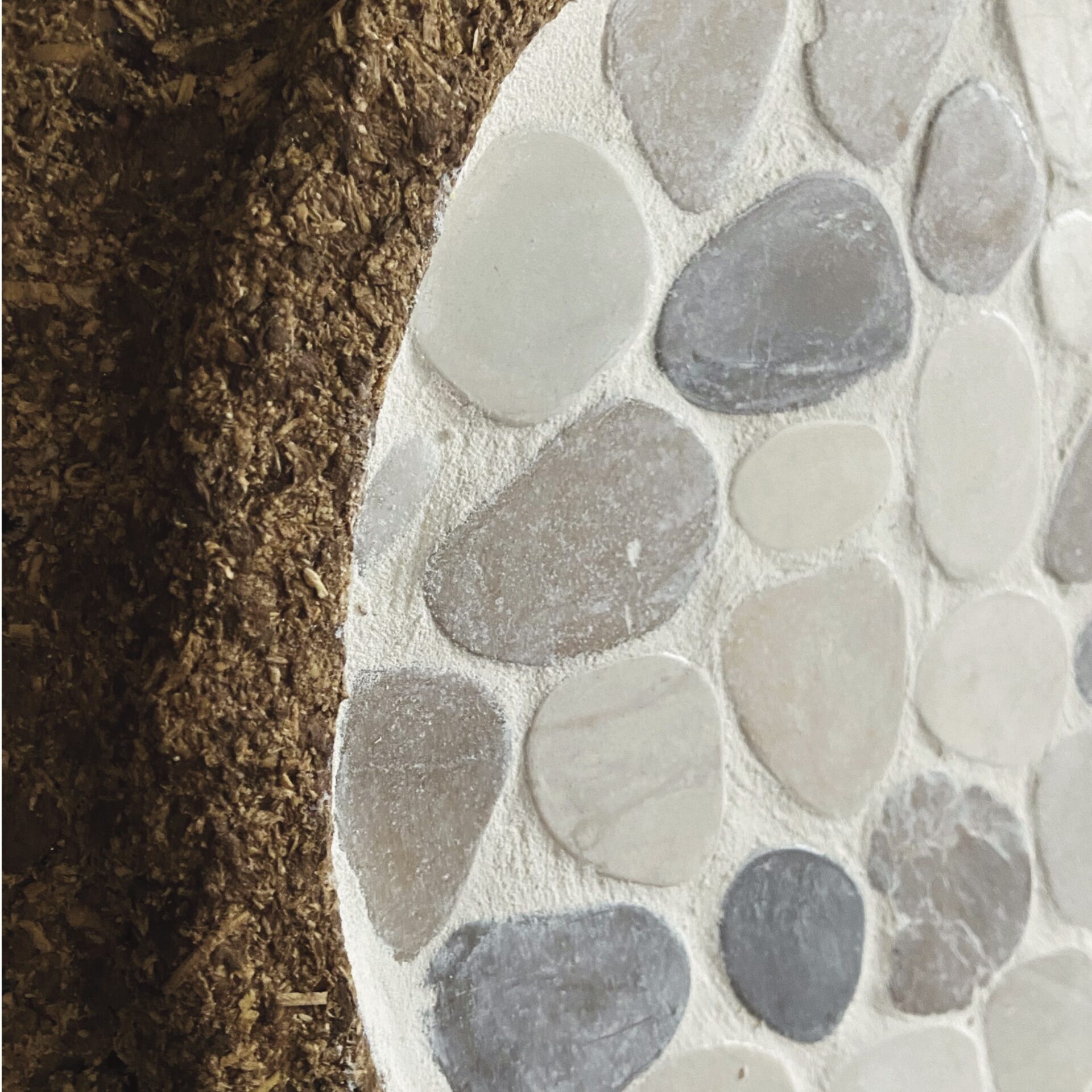 Detail of the LUNA table, Closeup of texture : cardboard pulp sawdust, stone.