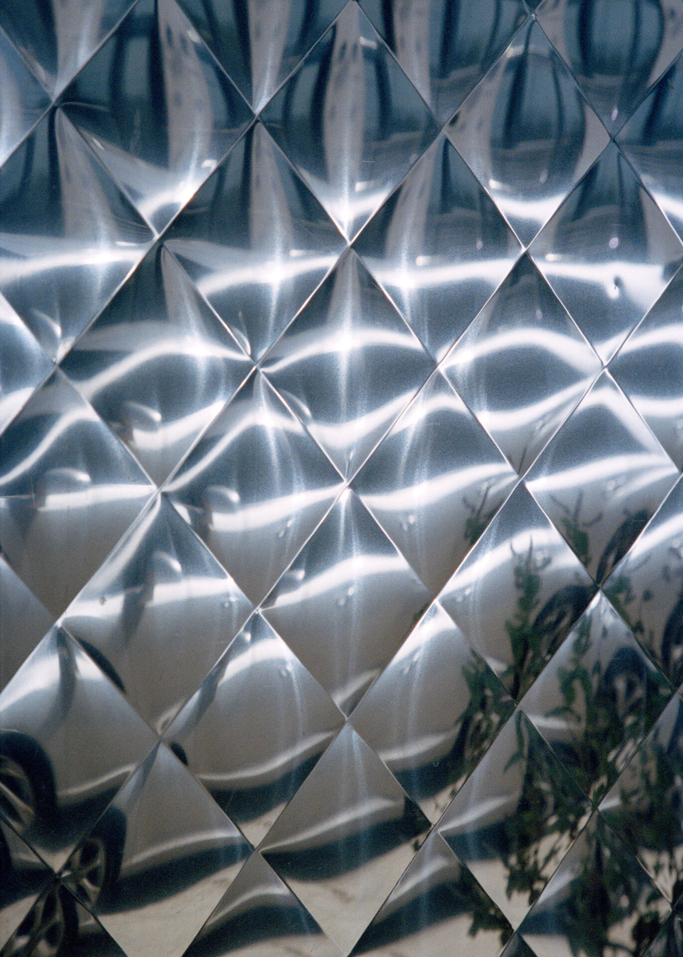 Reflective surface with diamond shaped pattern.