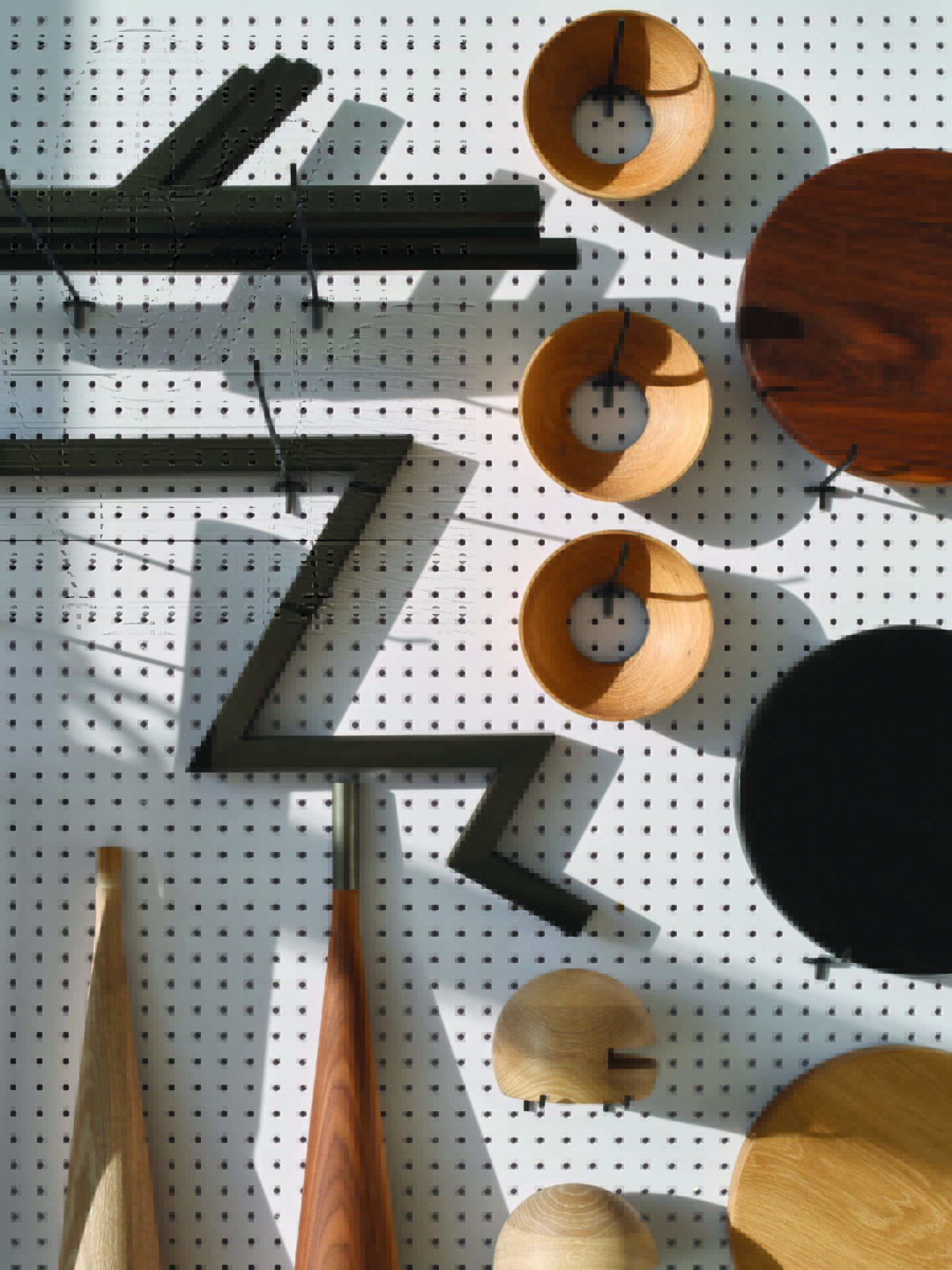 Close-up: Peg board of wooden fixtures in the hollis+morris production studio