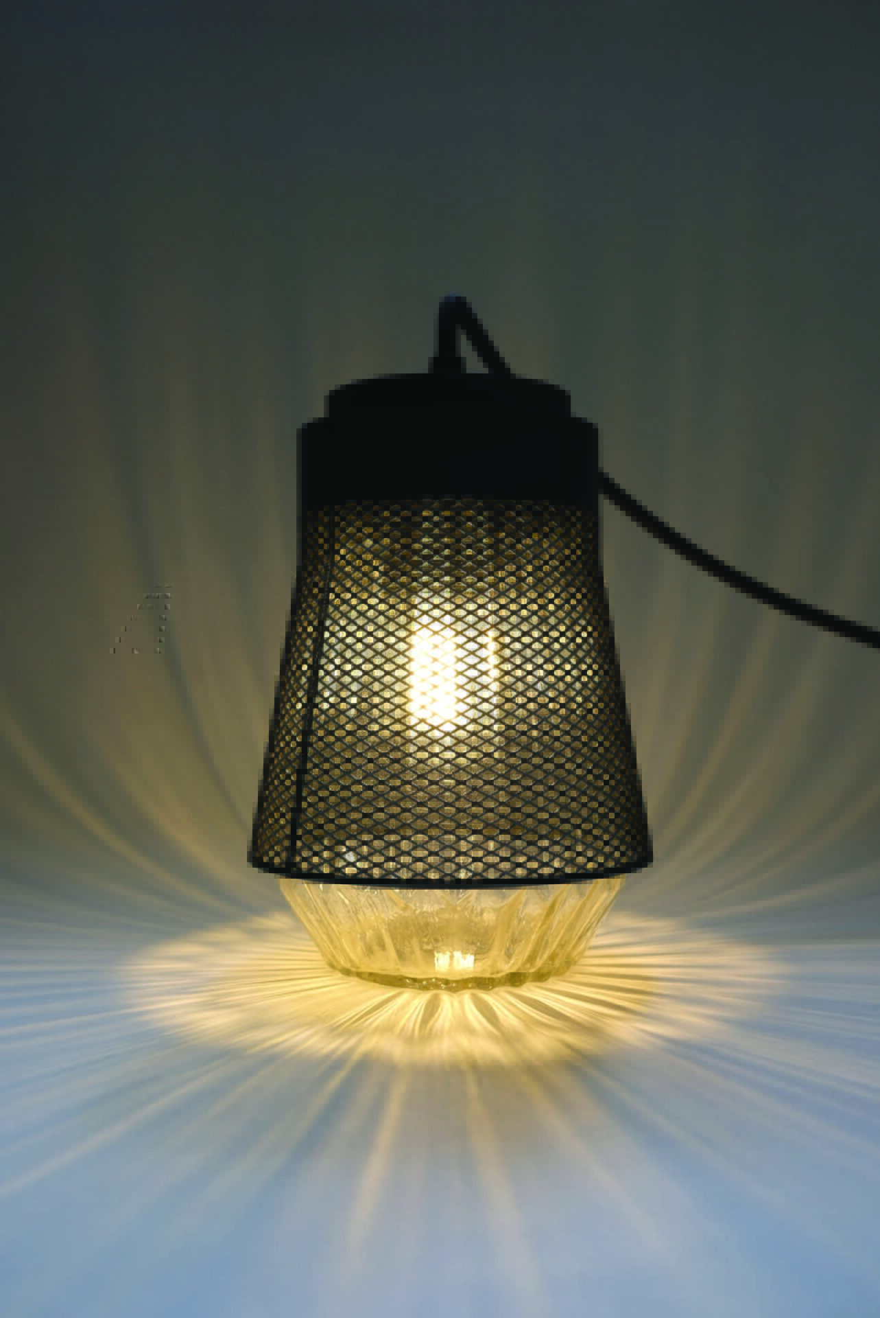 One suspended light illuminating the ground.