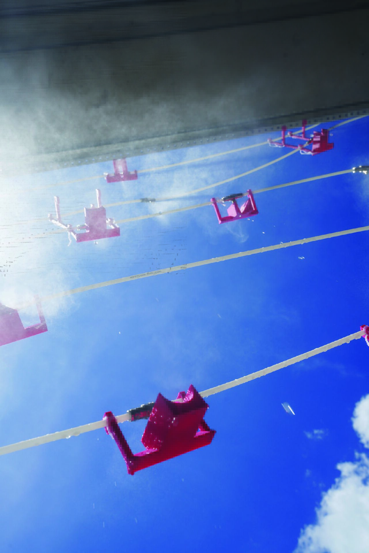 An overall view of an architectural model, made with thin yellow frames and mist.