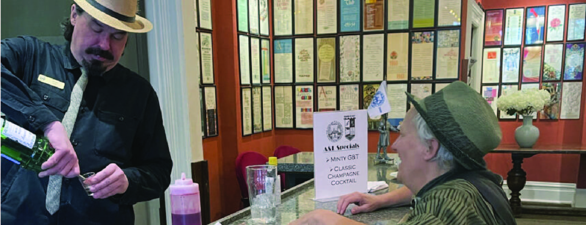 Interior of the Club. In the background are the Club's Executive Lists dating back to 1908, each an original work of art by a member. They showcase the evolution of Canadian graphic design through the years