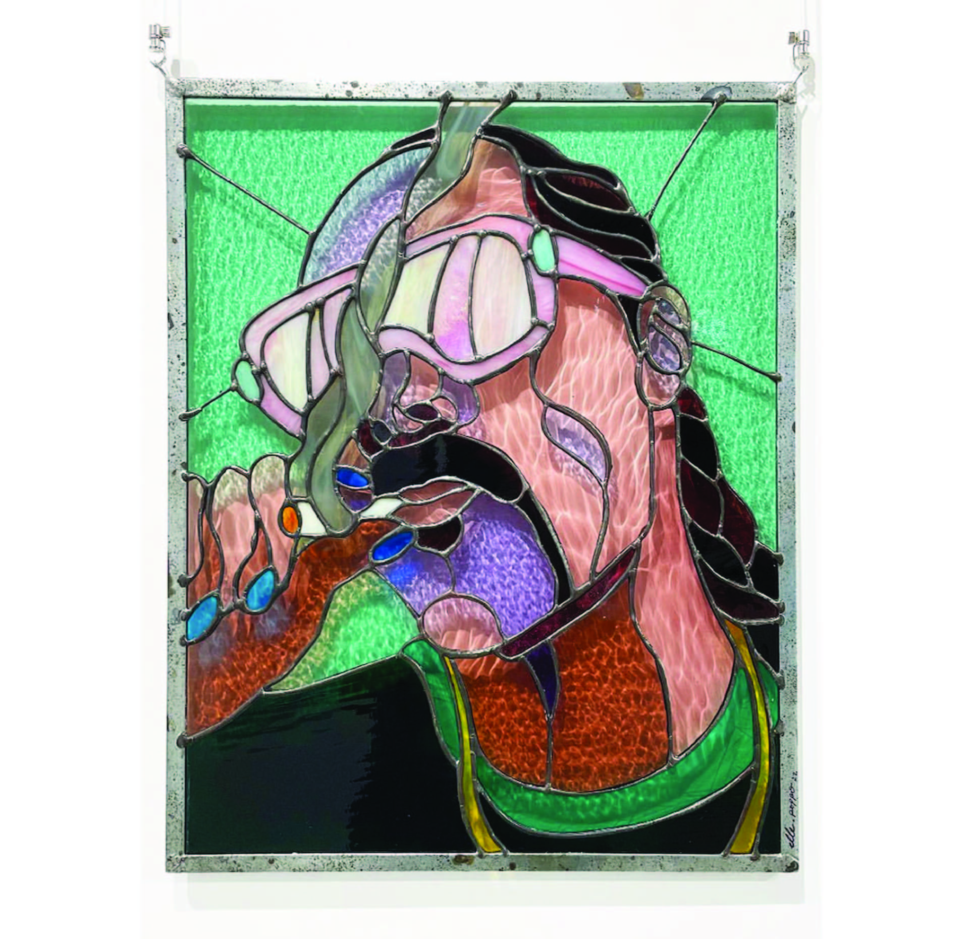 A stained glass portrait of Snoop Dogg.