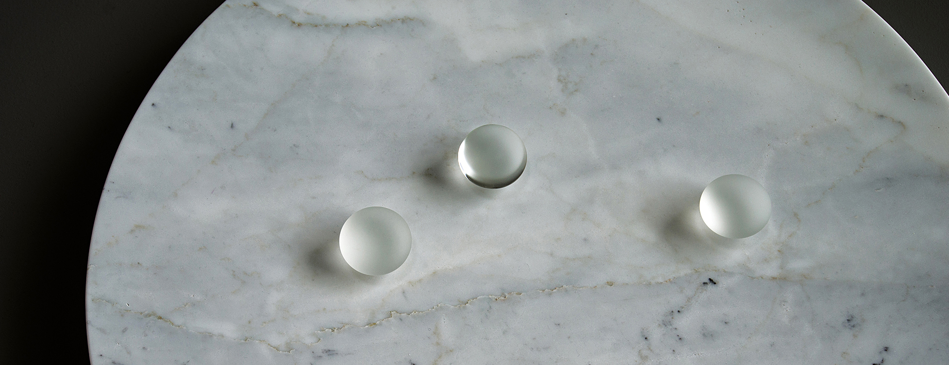 Hand-blown glass sculptures by artist Karen Miranda Abel. Black and white photographs of a waterfall on the Niagara Escarpment by Karen Miranda Abel.