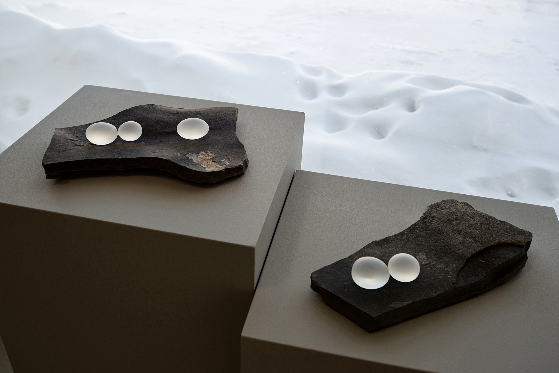 Hand-blown glass sculptures on stone by artist Karen Miranda Abel.