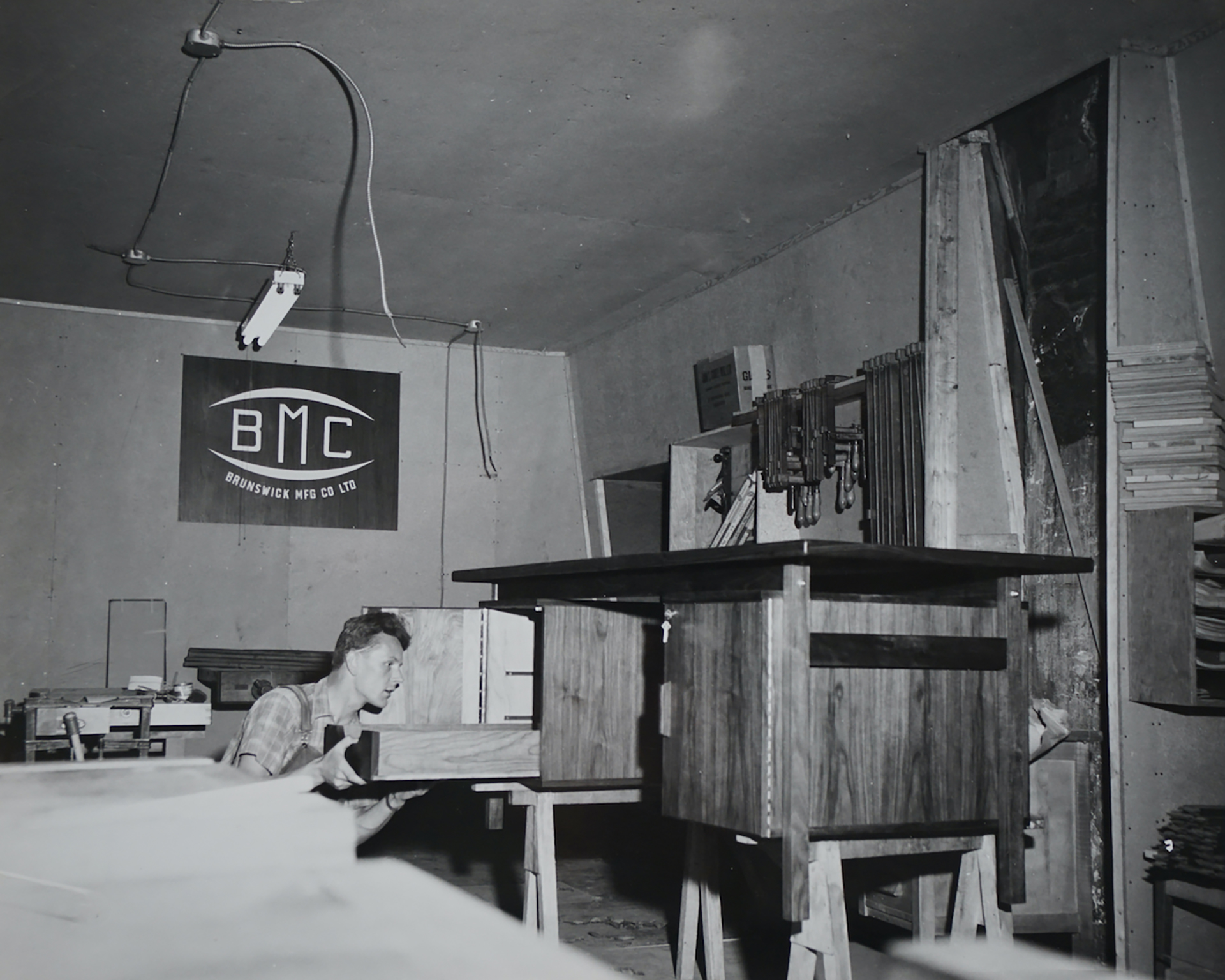 A man in a woodworking studio in the 1960s.