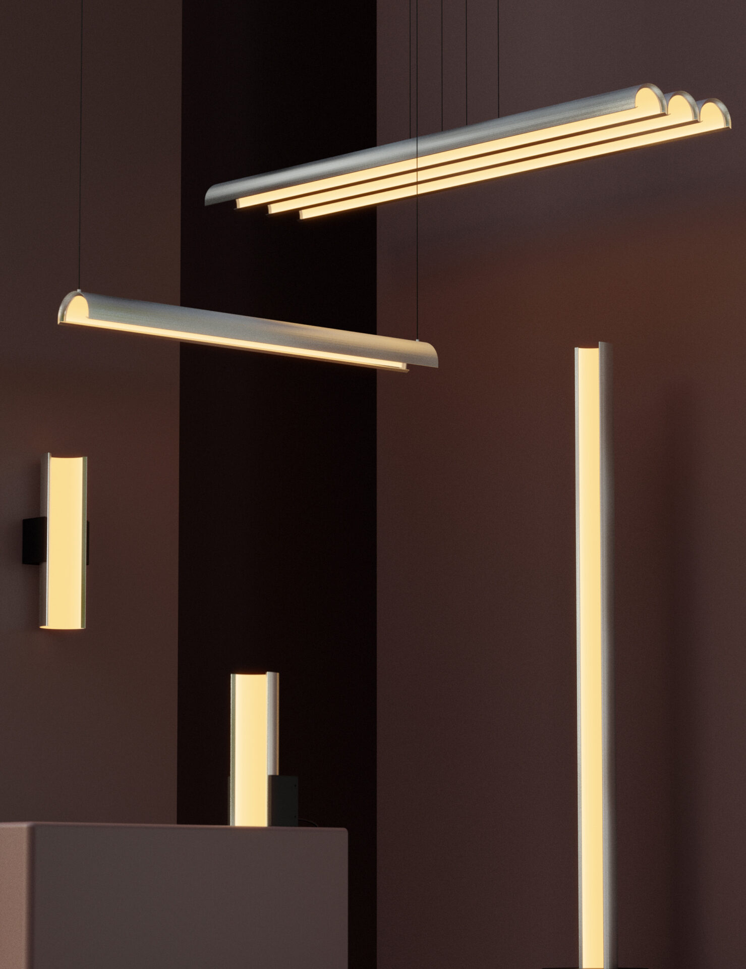 A rendering of the pola collection. All different lengths and orientations of what looks like a pipe cut down the centre into an arc. A tall floor lamp, a shorter table lamp, a wall sconce, a long linear chandelier, and a long cluster chandelier.