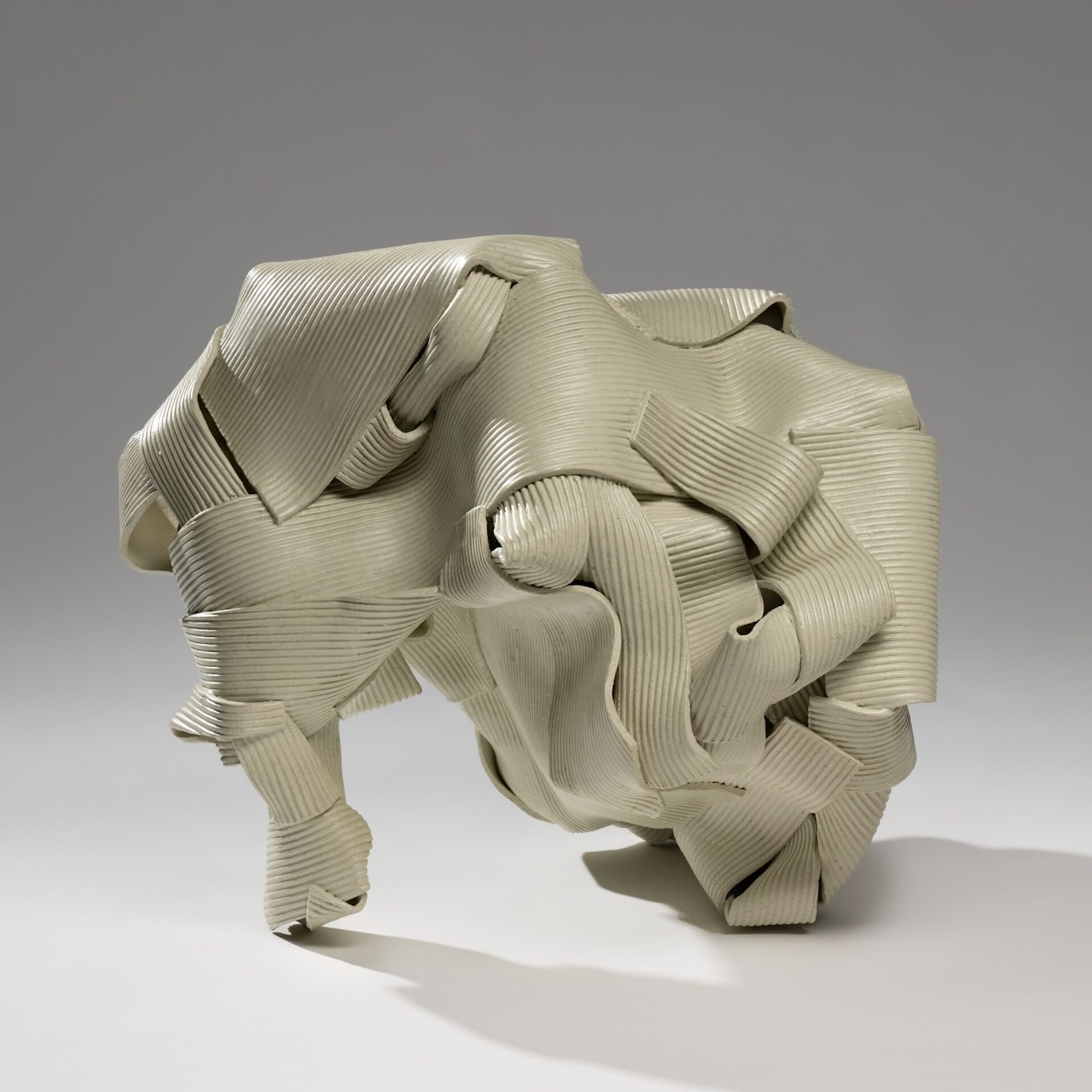 ceramic sculpture with ribbon-like strips of clay entangled together
