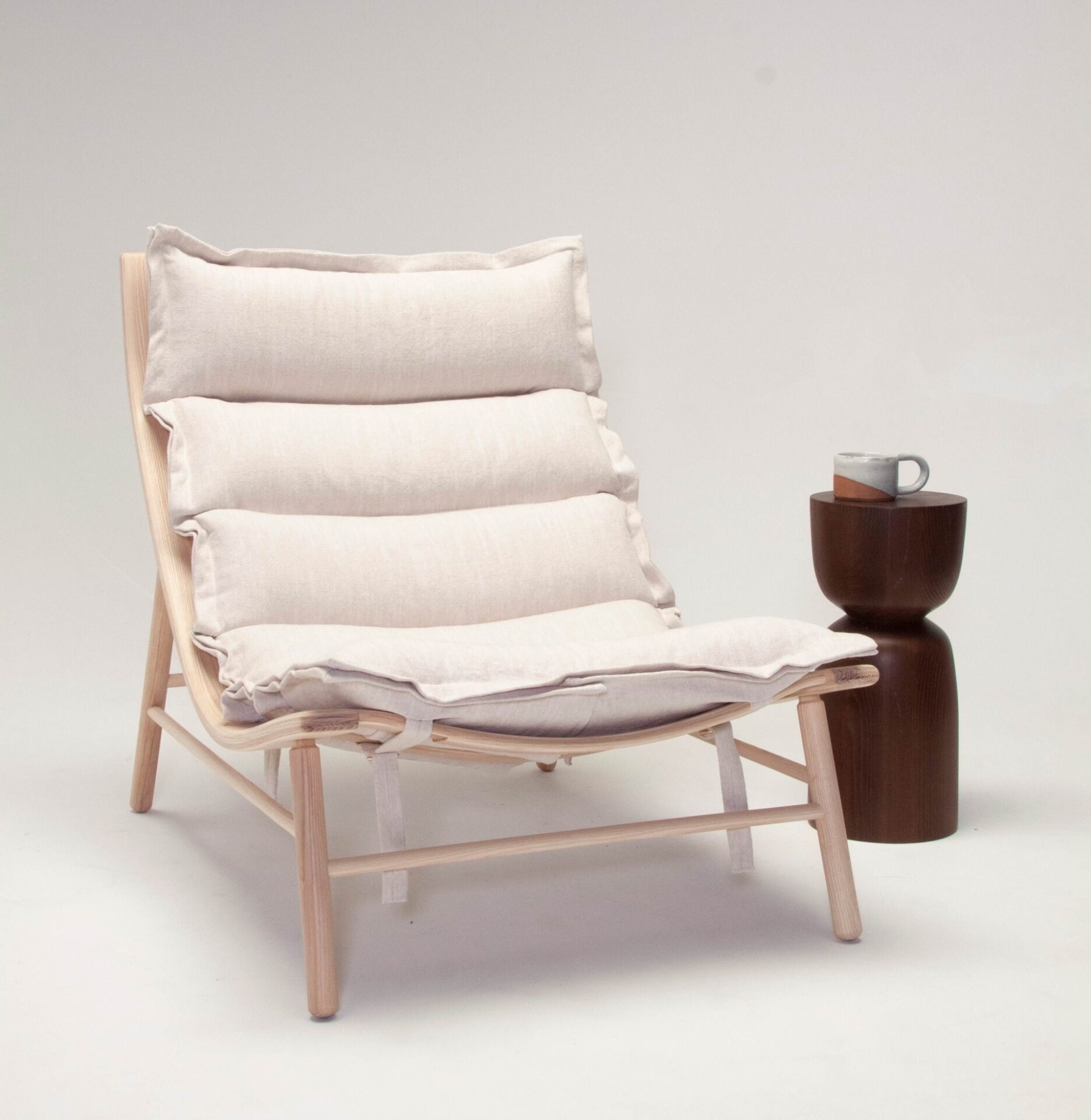 Lounge chair and side table with coffee cup