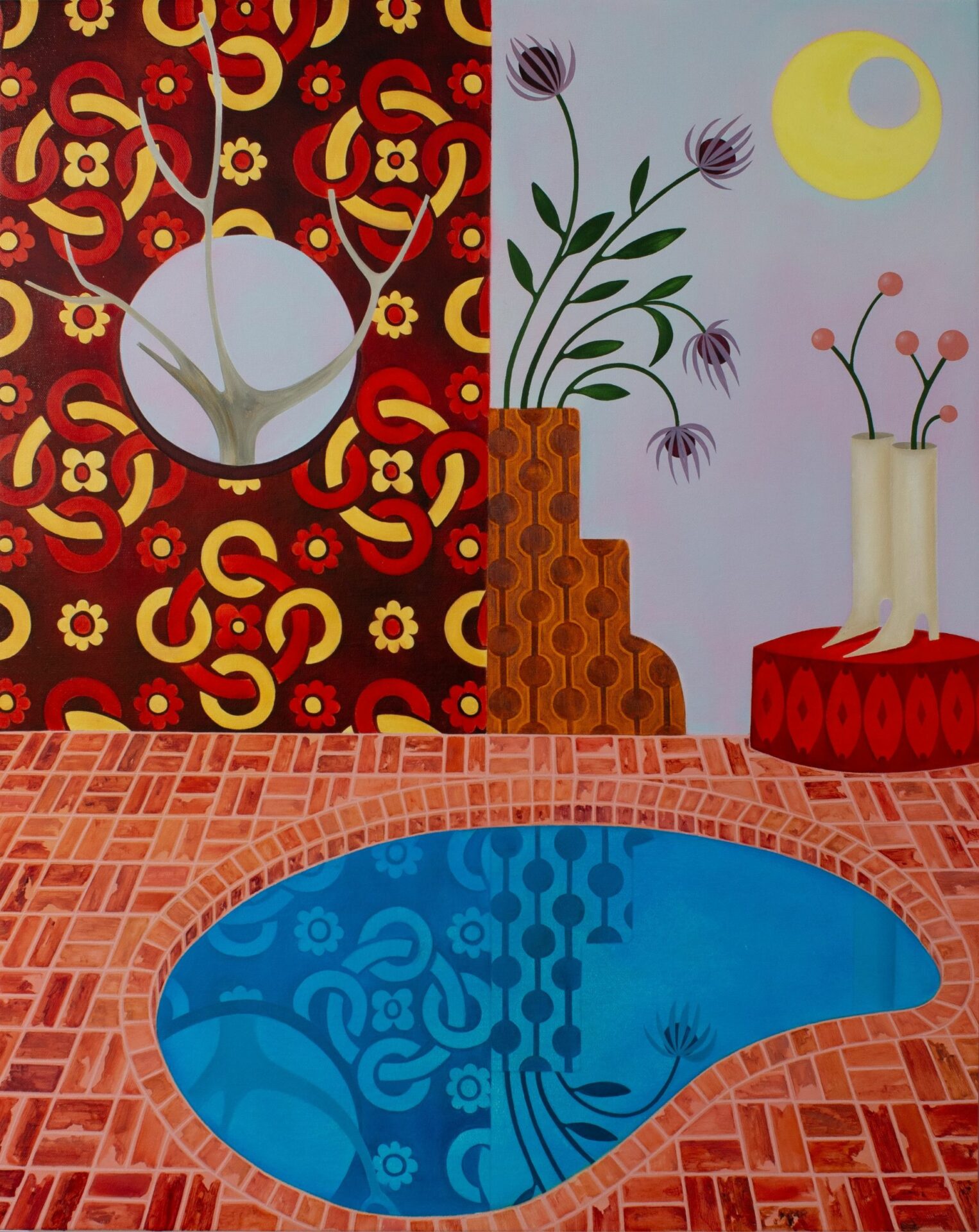 A small kidney shaped pool with a brick pool deck, backed by a patterned wall and white boots with flowers inside.