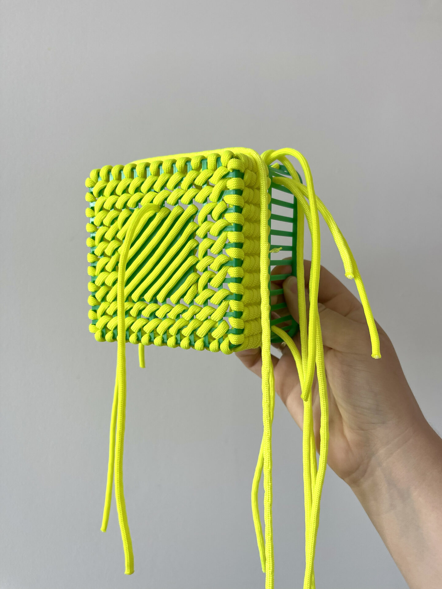 Berry basket with some test stitching in neon yellow rope