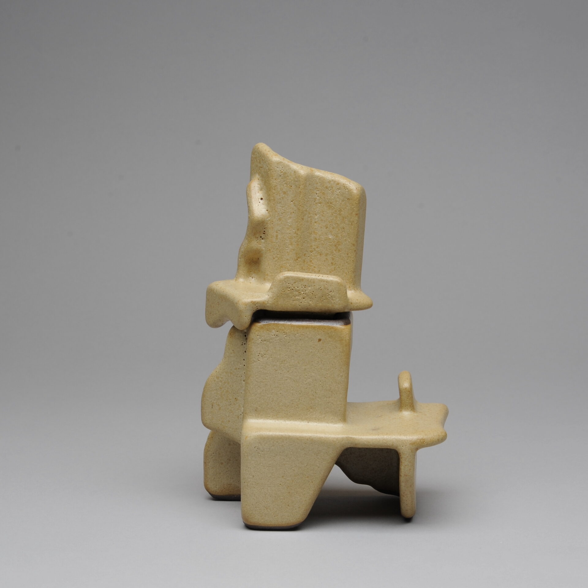 Beige ceramic sculpture with angular shapes