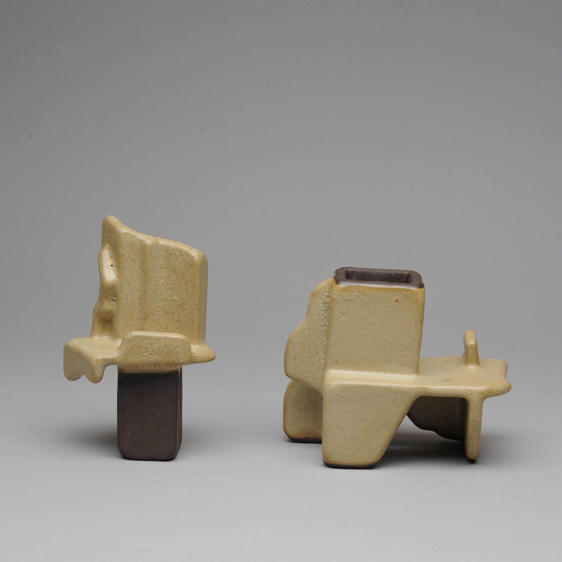 Beige ceramic sculpture with angular shapes in two parts