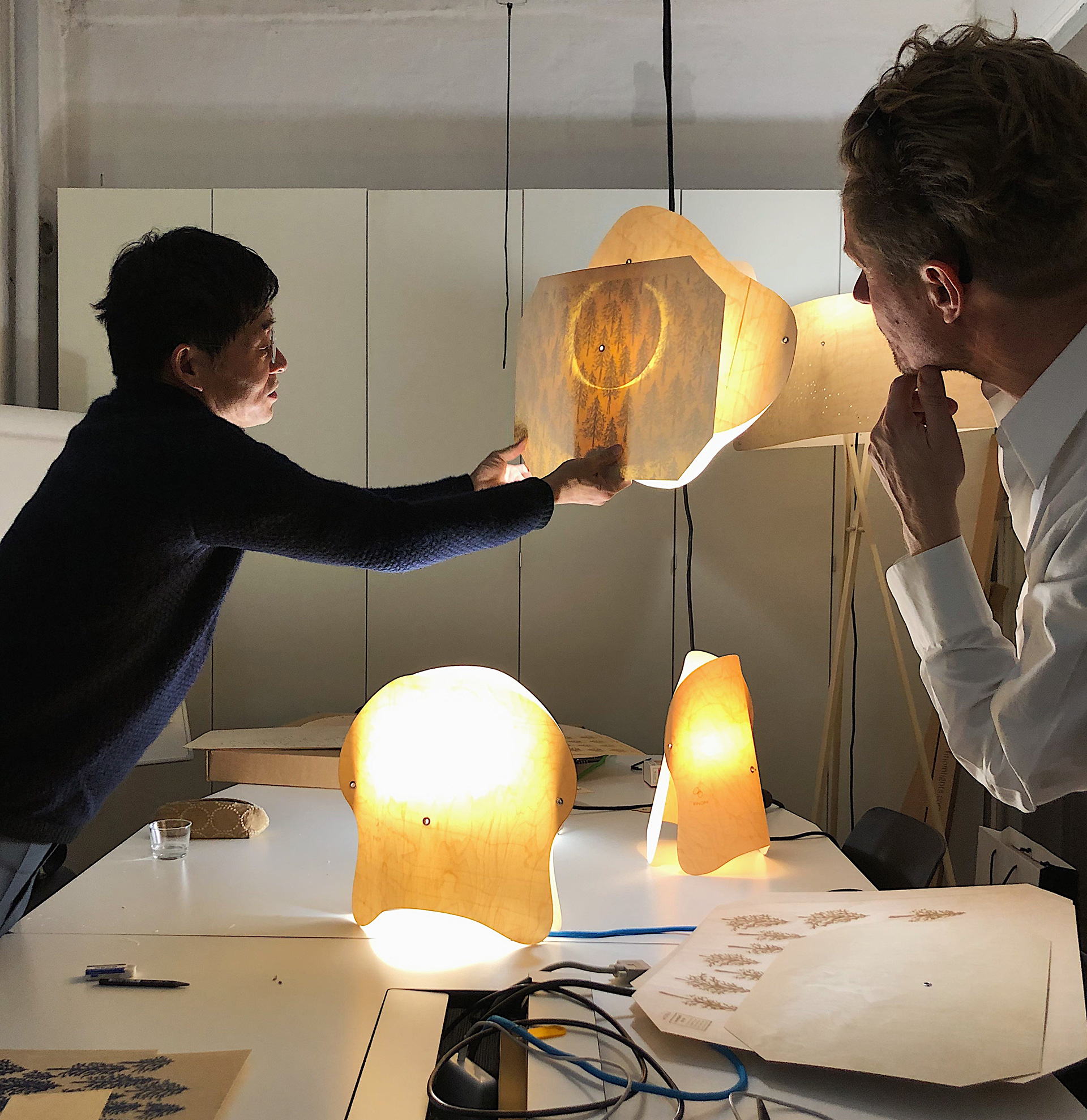 Collaborators Akira Minagawa and Esa Vesmanen testing lamp design