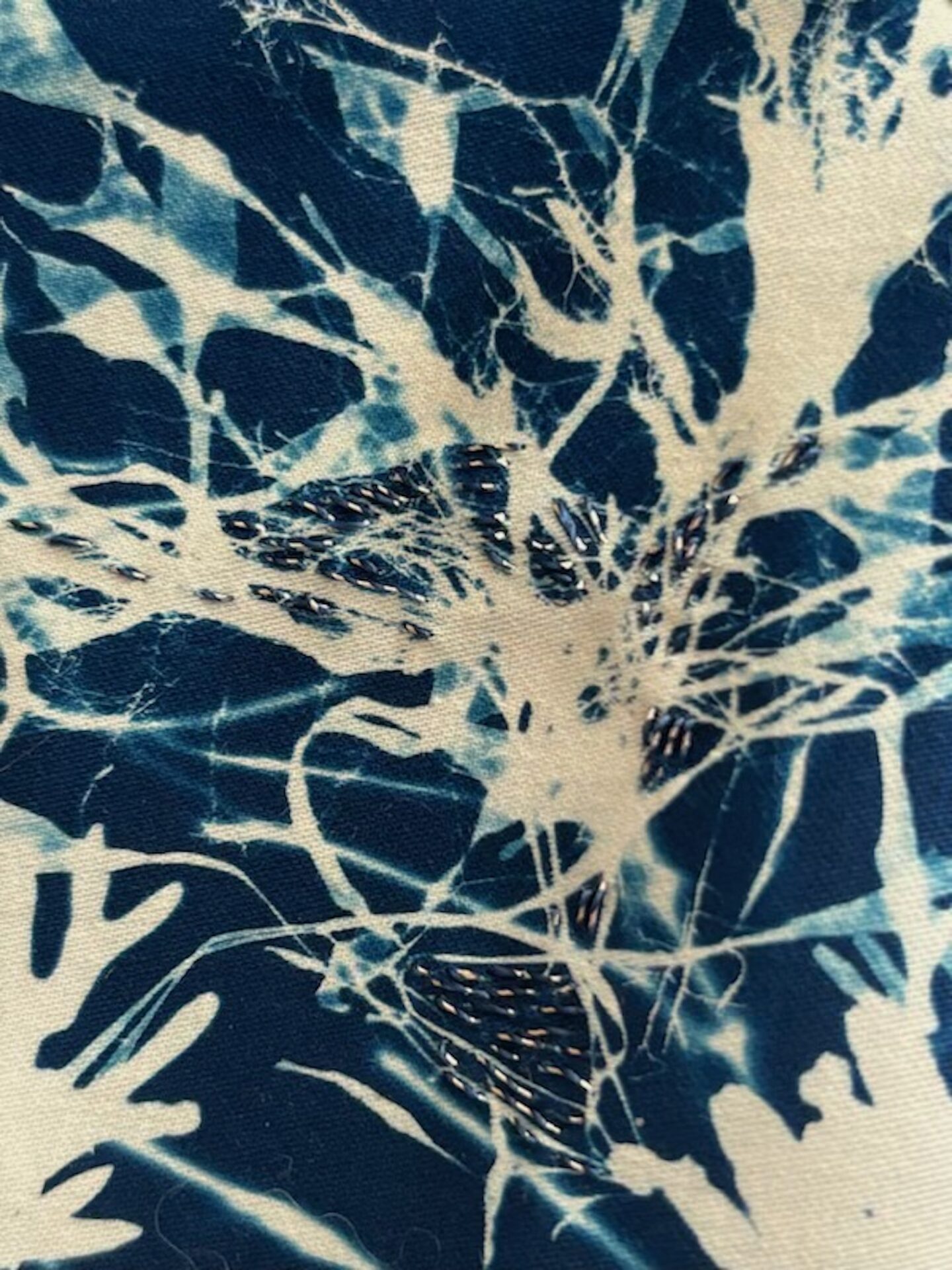 Detail of blue and white abstract plant print